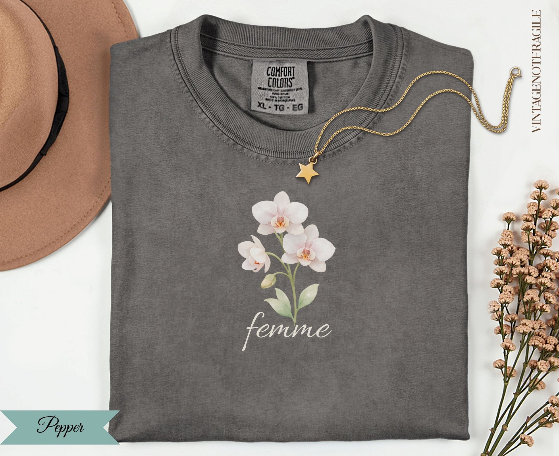 Charcoal Comfort Colors t-shirt with white orchid graphic and "femme" text.