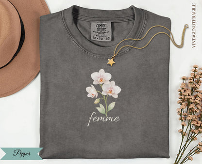 Charcoal Comfort Colors t-shirt with white orchid graphic and "femme" text.