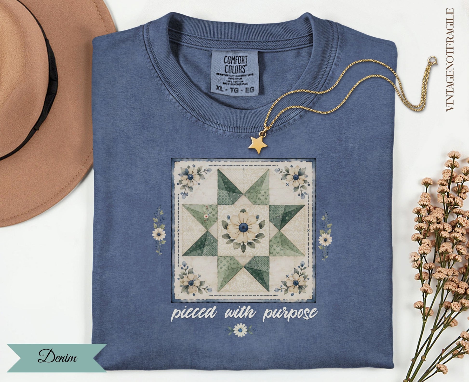 Denim t-shirt with patchwork star design and "pieced with purpose" text.