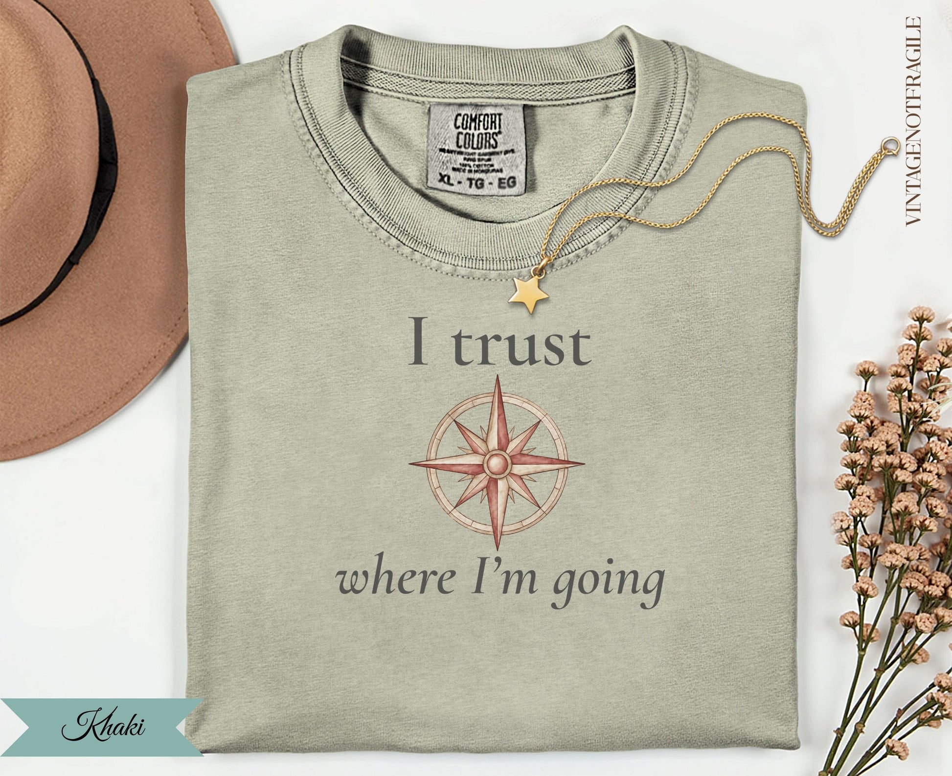 Khaki t-shirt with compass graphic and "I trust where I'm going" text.