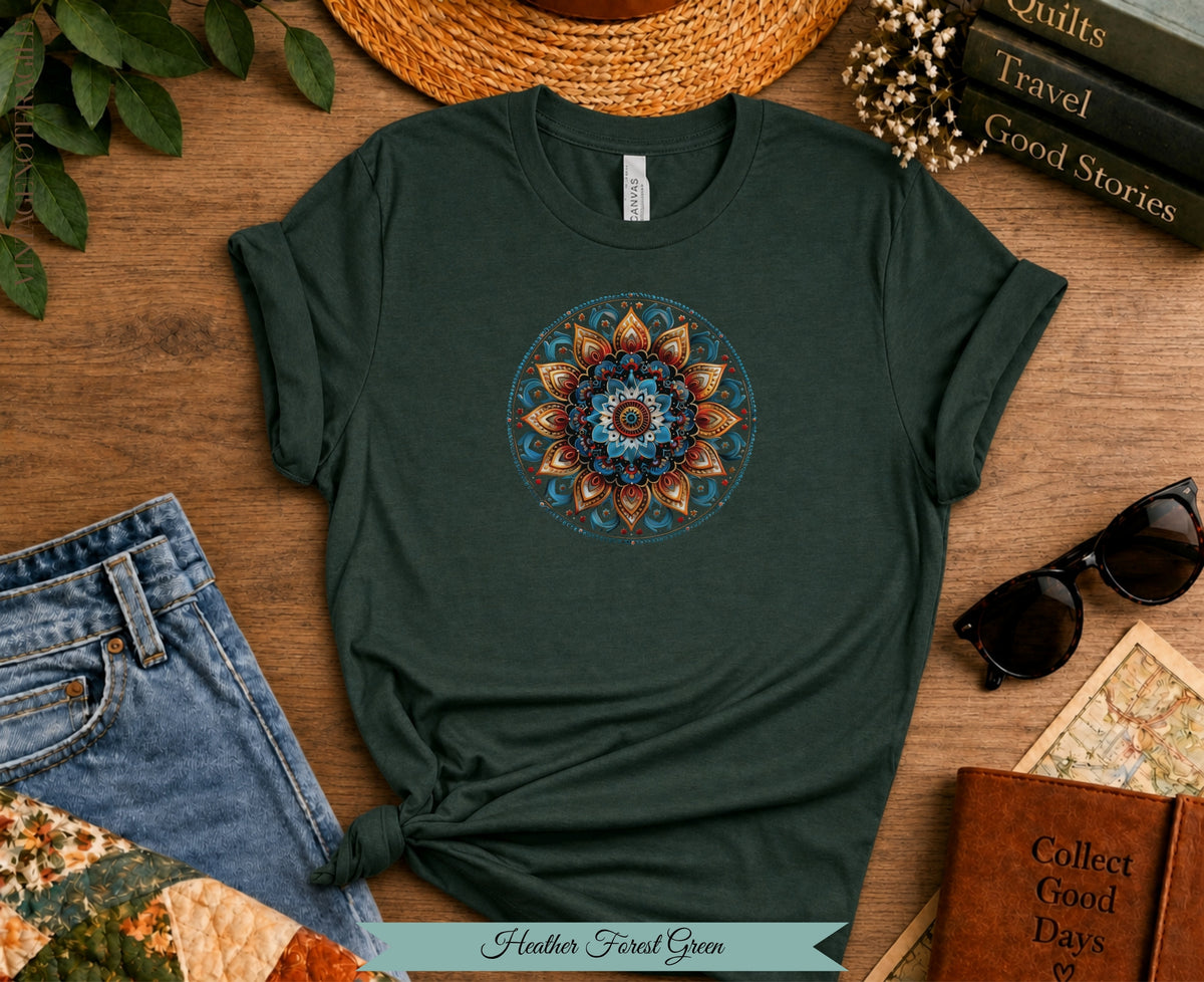 Dark green t-shirt with colorful mandala design, styled with jeans and sunglasses.