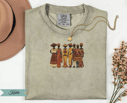 T-shirt featuring a graphic of diverse women in traditional attire.