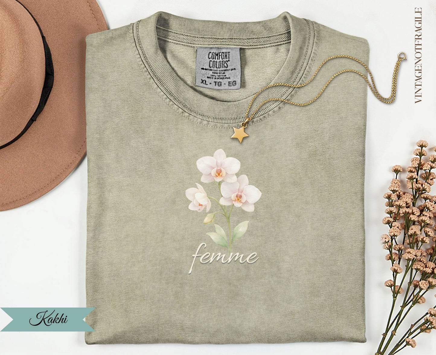 Khaki t-shirt with "Femme" and orchid graphic, gold star necklace.
