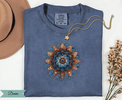 Blue Comfort Colors t-shirt with a colorful mandala design and gold star necklace.