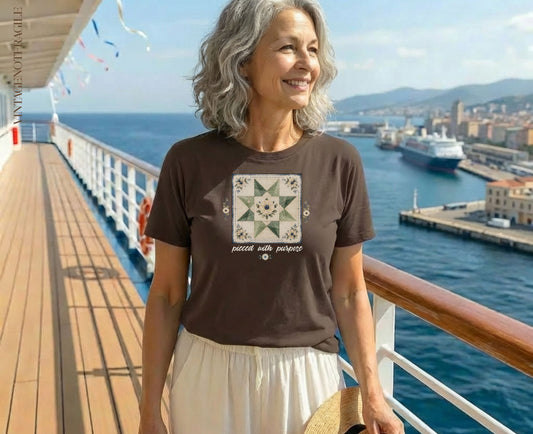 Woman in brown t-shirt with quilt star graphic and text "pieced with purpose".