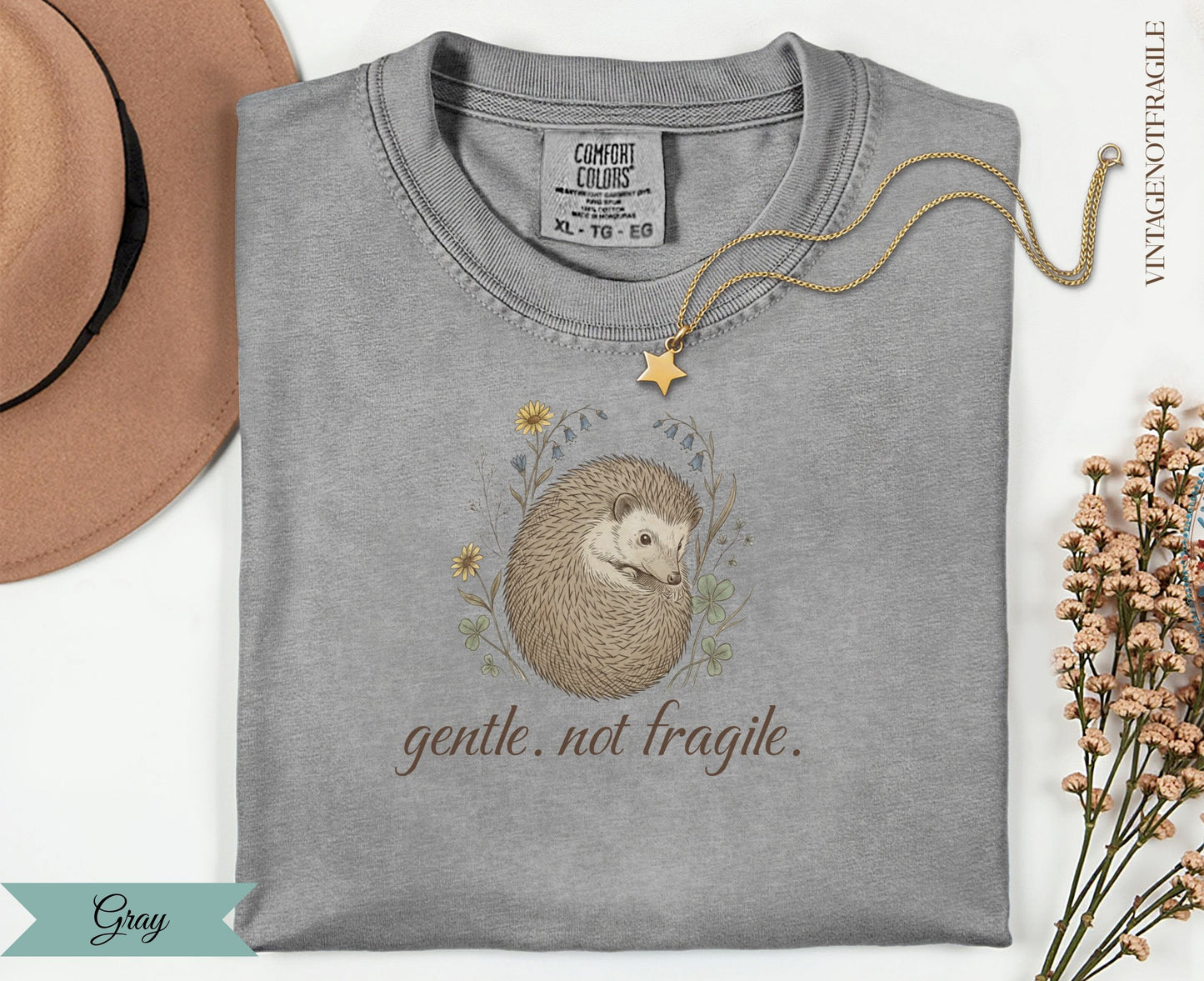 Gray Comfort Colors t-shirt with a hedgehog illustration and "gentle. not fragile." text.
