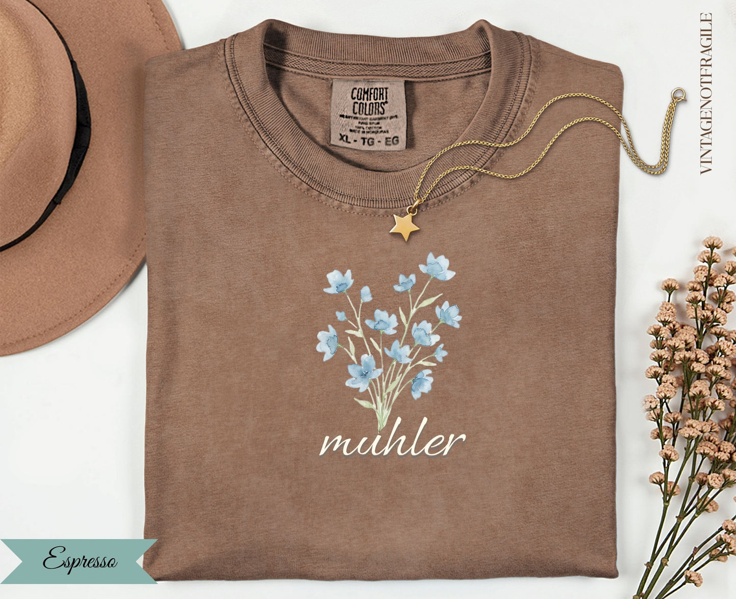 Espresso t-shirt with blue floral bouquet graphic and "muhler" text.