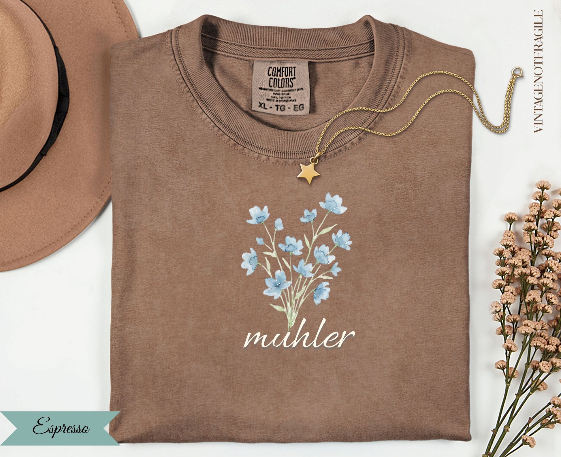 Espresso t-shirt with blue floral bouquet graphic and "muhler" text.
