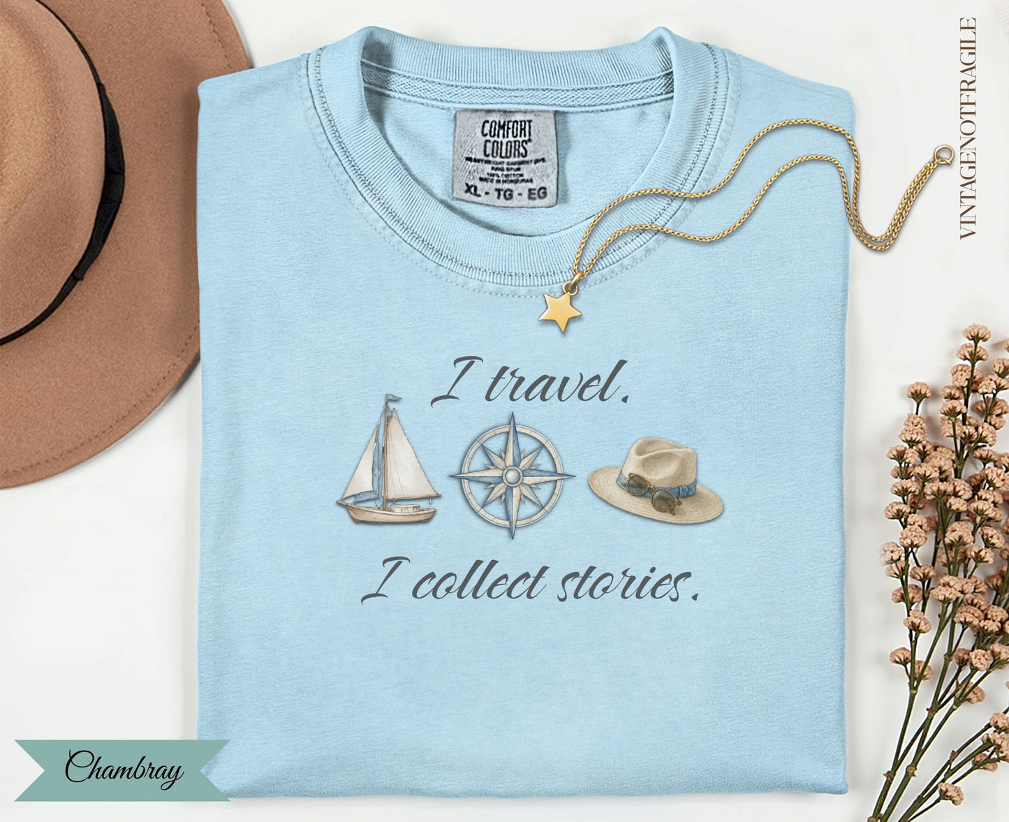 Light blue t-shirt with "I travel. I collect stories." and travel icons.