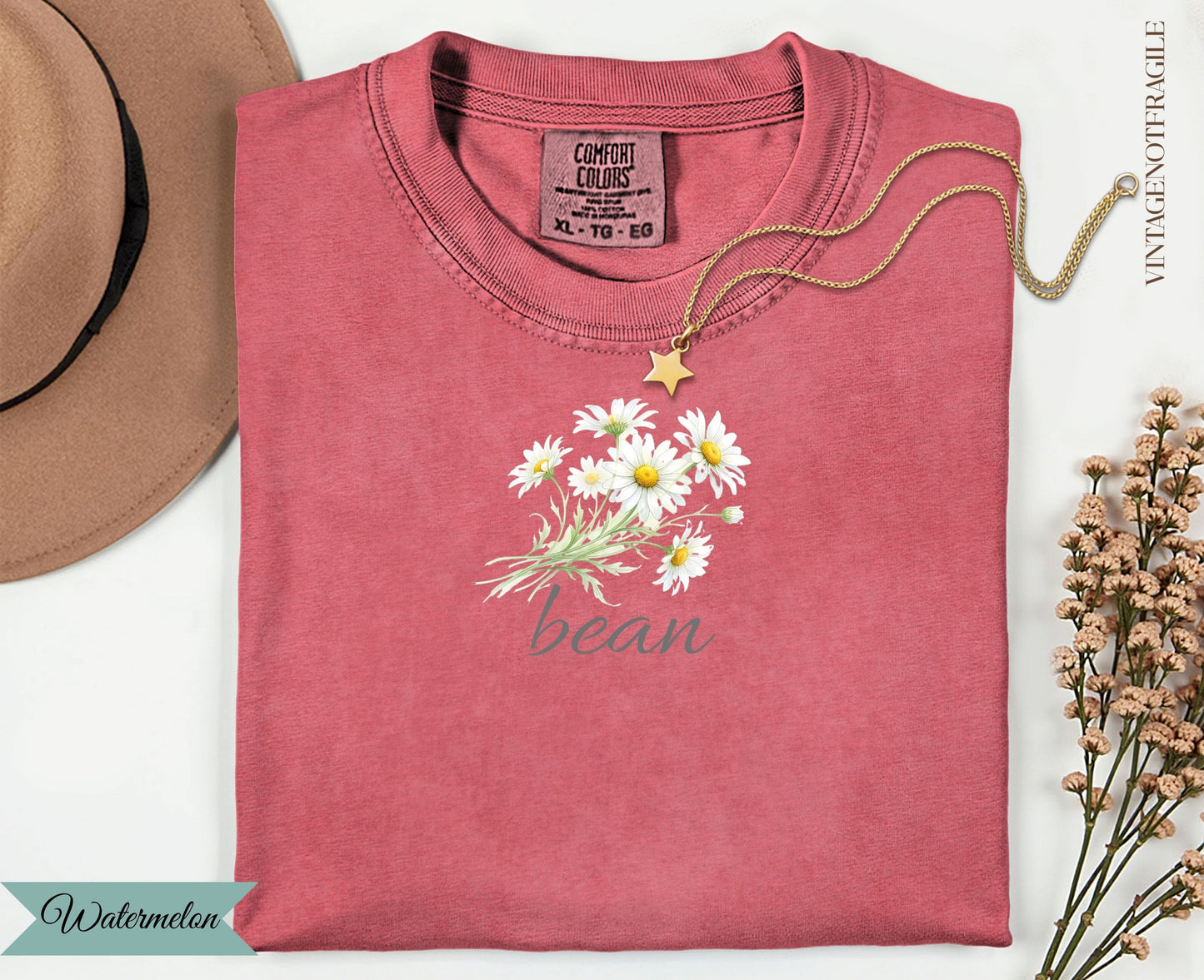 Red t-shirt with daisies and "bean" text, vintage not fragile tag.
