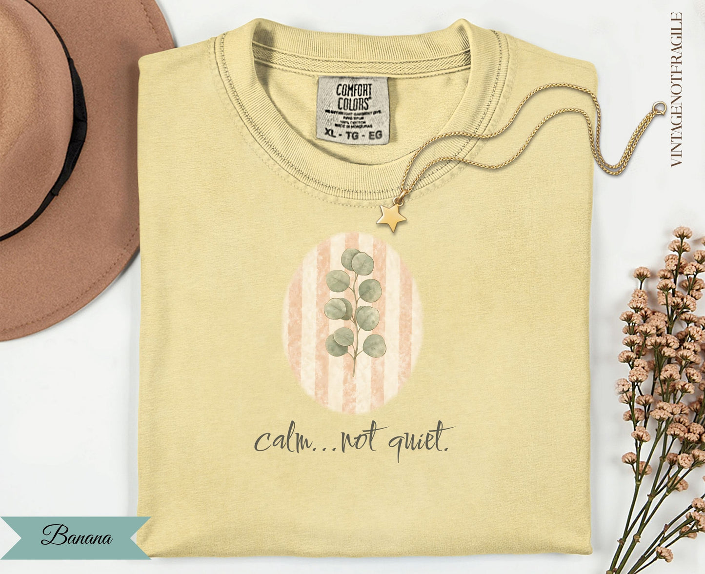 Yellow t-shirt with oval graphic and "calm...not quiet." text.