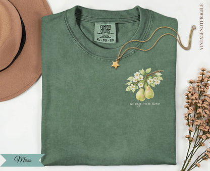 Green Comfort Colors t-shirt with pear branch and "in my own time" text.