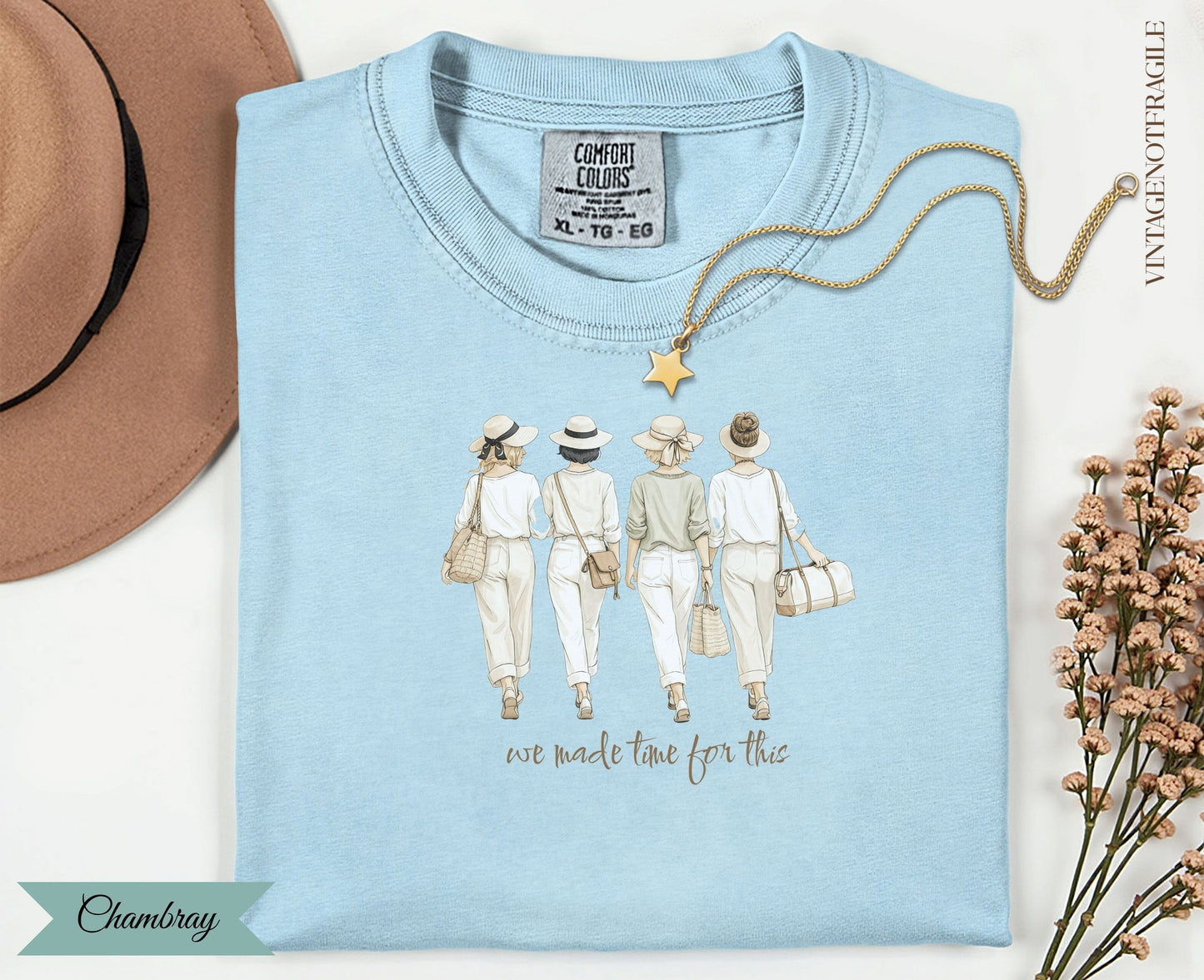 Light blue t-shirt with graphic of four women in hats and white outfits; text "we made time for this".