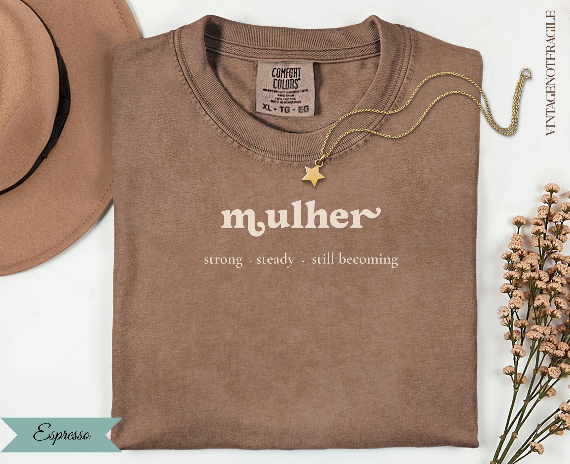 Espresso t-shirt with "mulher strong steady. still becoming" text.