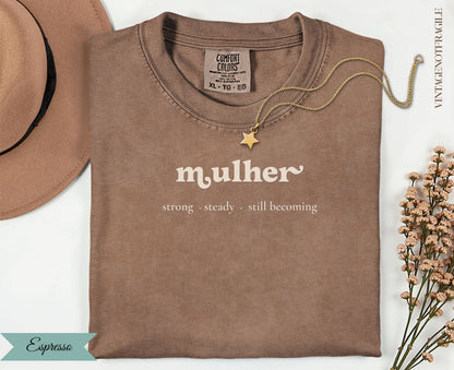 Espresso t-shirt with "mulher strong steady. still becoming" text.