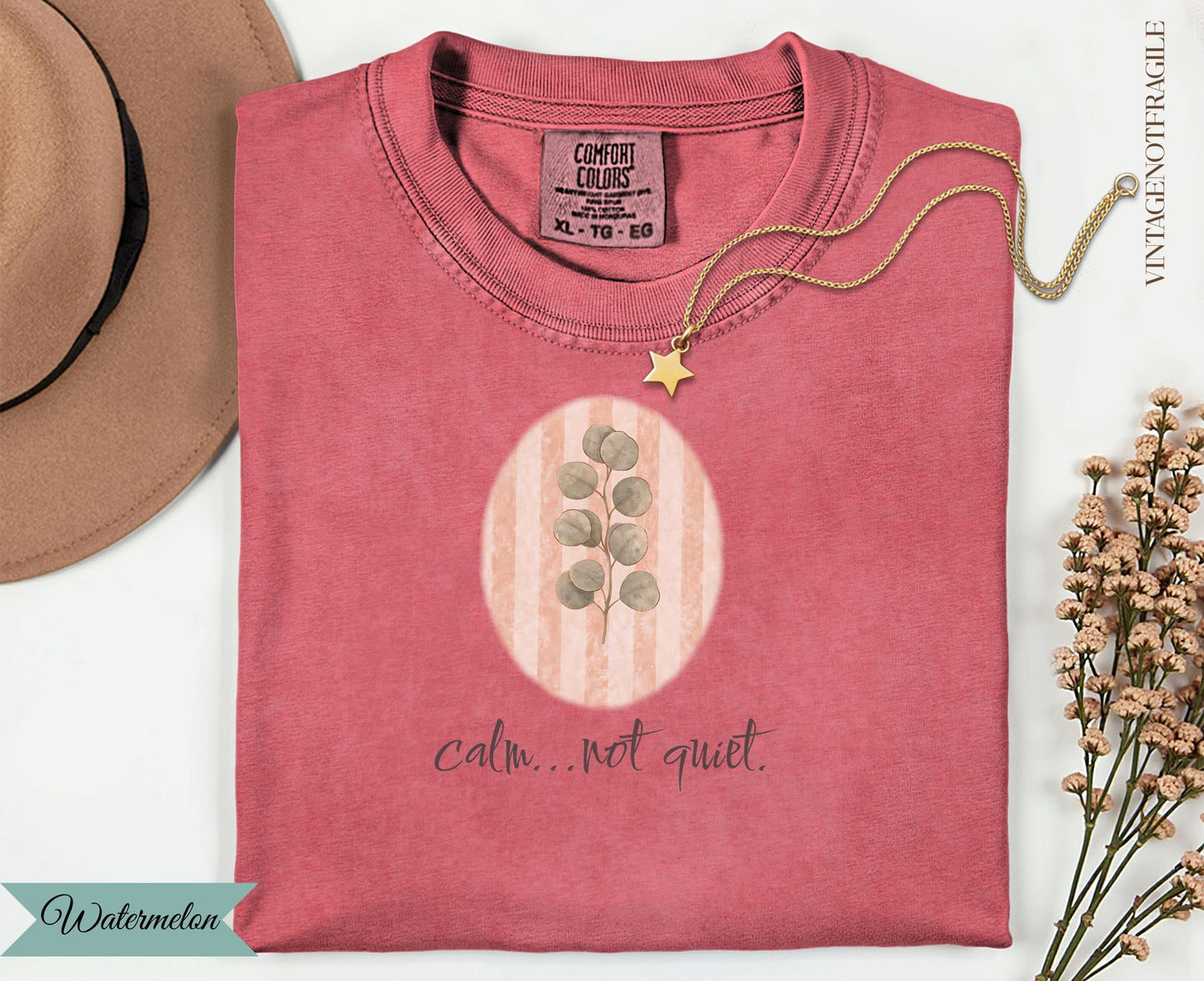 Coral t-shirt with watercolor eucalyptus branch and text "calm... not quiet."