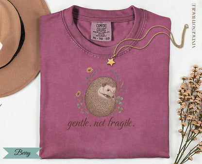 Berry Comfort Colors t-shirt with hedgehog and "gentle. not. fragile." text.