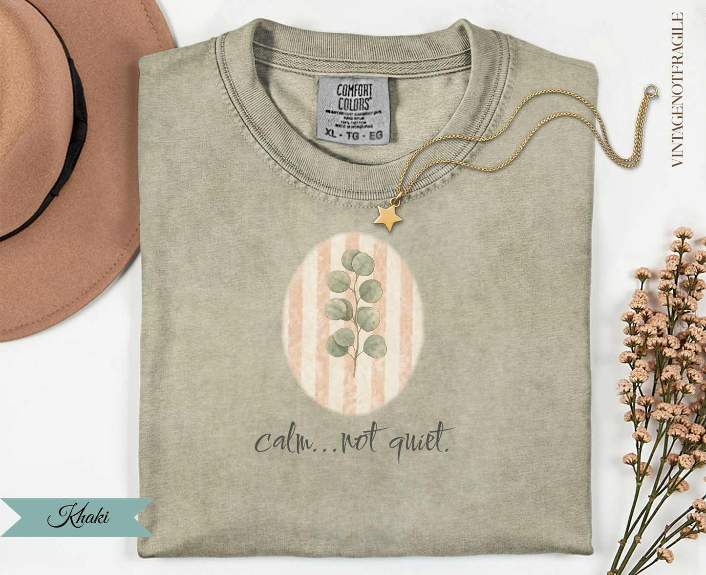 Khaki t-shirt with oval design and "calm...not quiet." text.