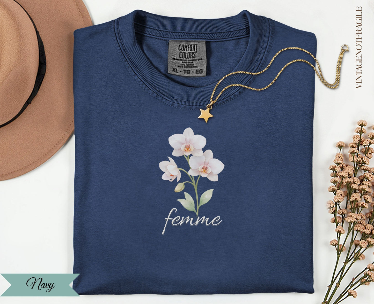 Navy t-shirt with white orchid graphic and "femme" text.