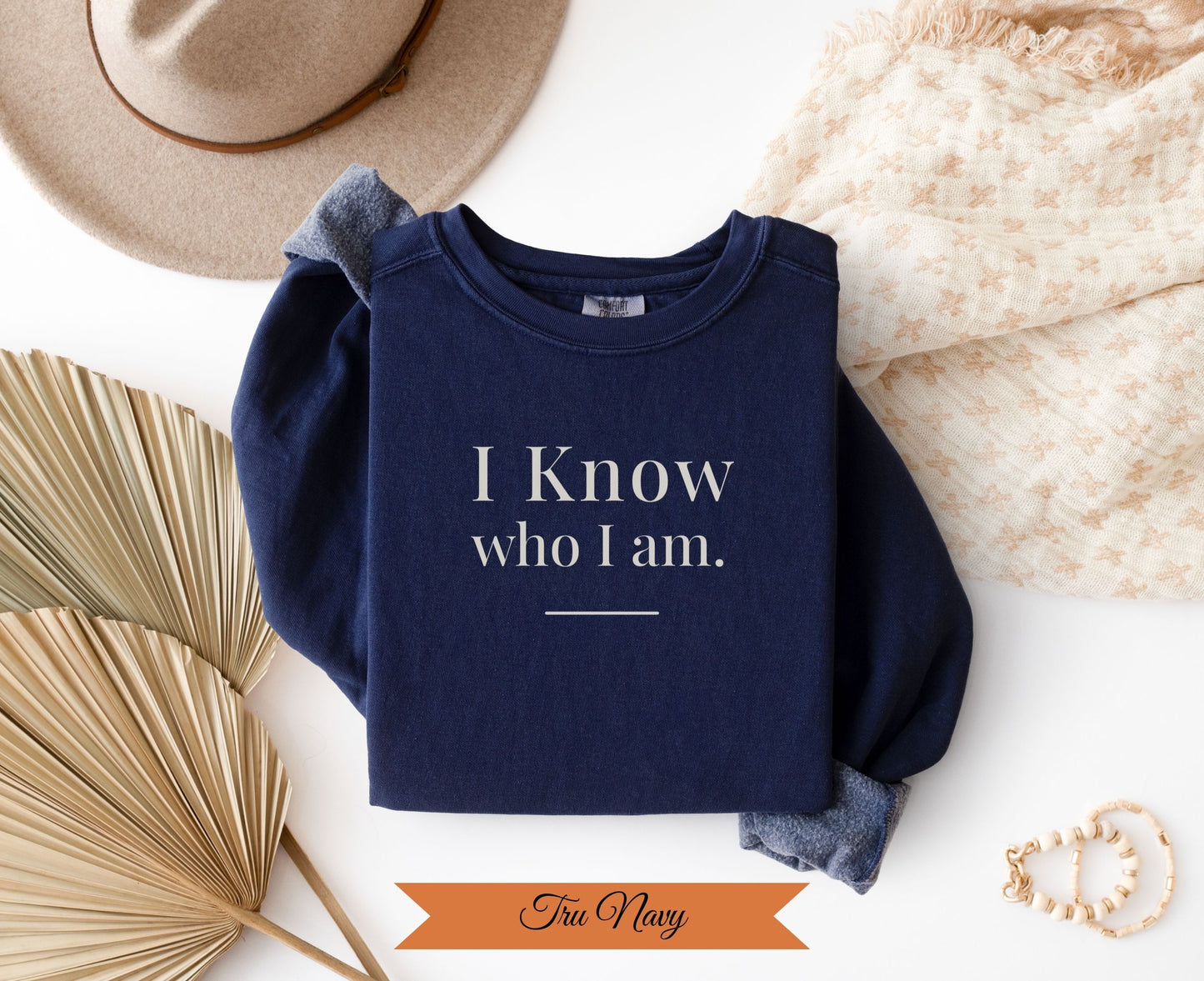 Navy sweatshirt with "I Know who I am." and "Truu Navy" text.
