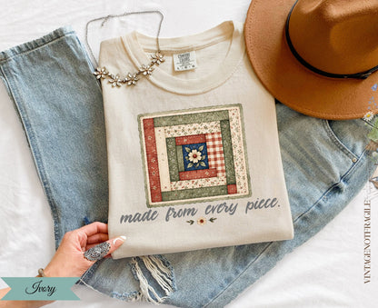 Cream sweatshirt with patchwork quilt design and text "made from every piece."