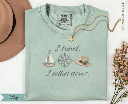 Pale green t-shirt with "I travel. I collect stories." and nautical illustrations.