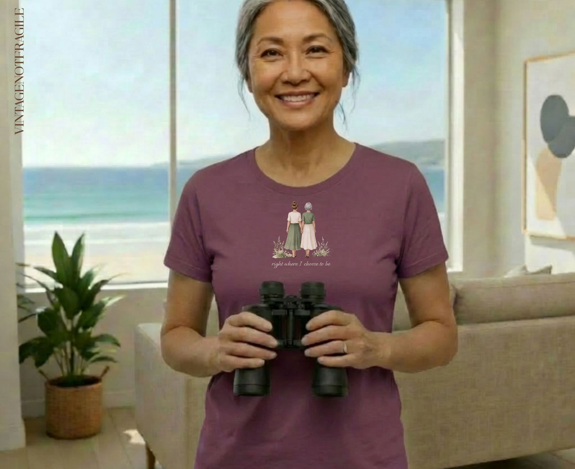 Woman wearing plum t-shirt with floral graphic and text "right where I choose to be".